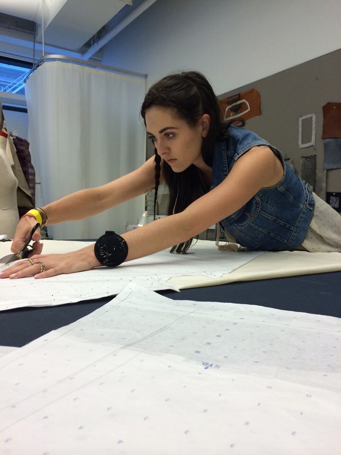 Cutting a pattern in the studio
