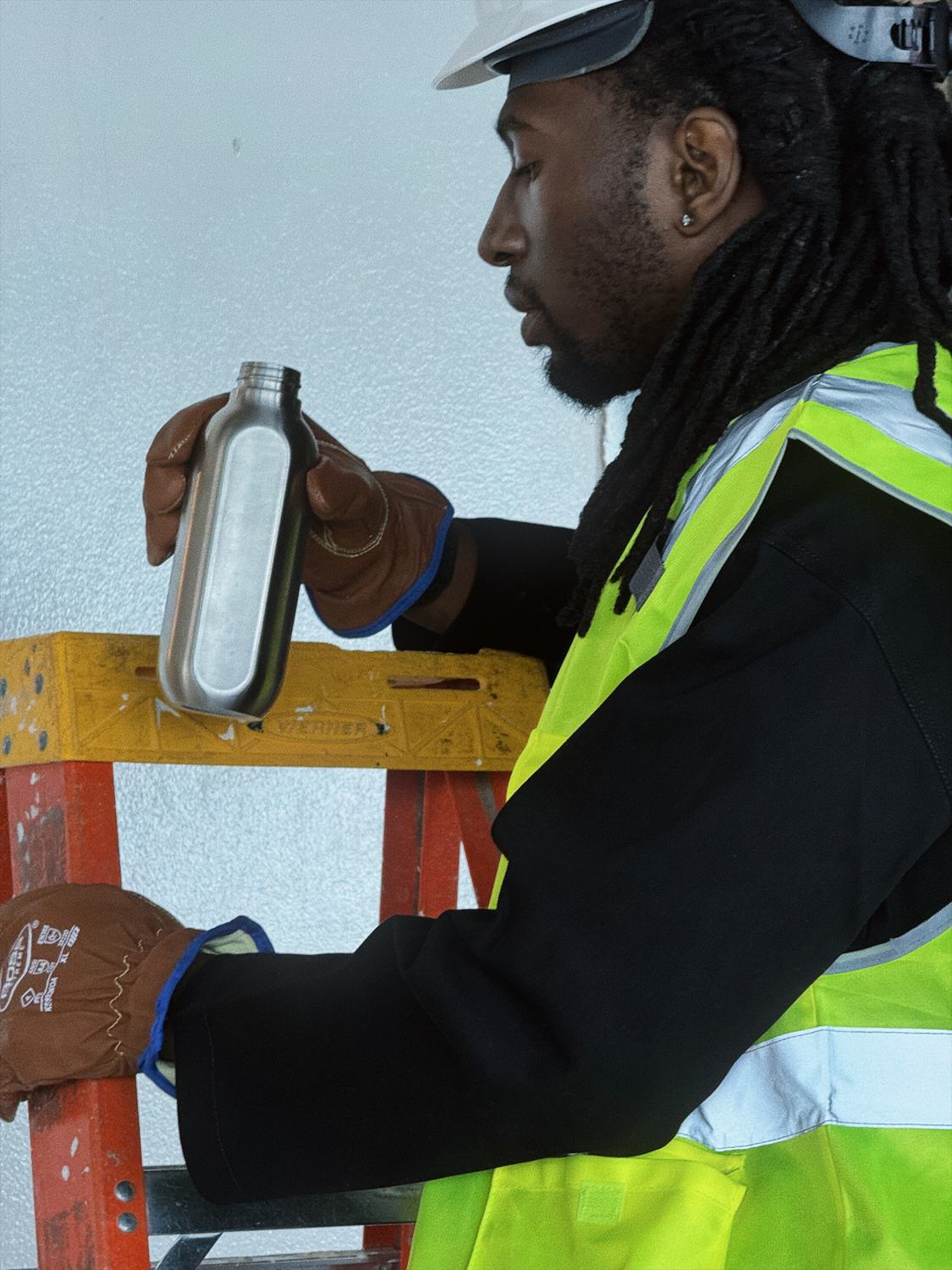 A worker on site with the Kadeya bottle